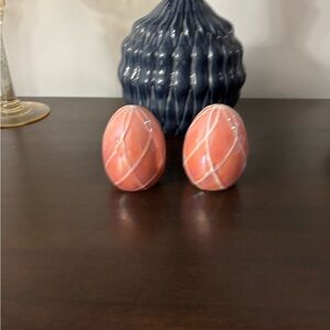 Iridescent pink ceramic Easter egg salt and pepper shakers.
